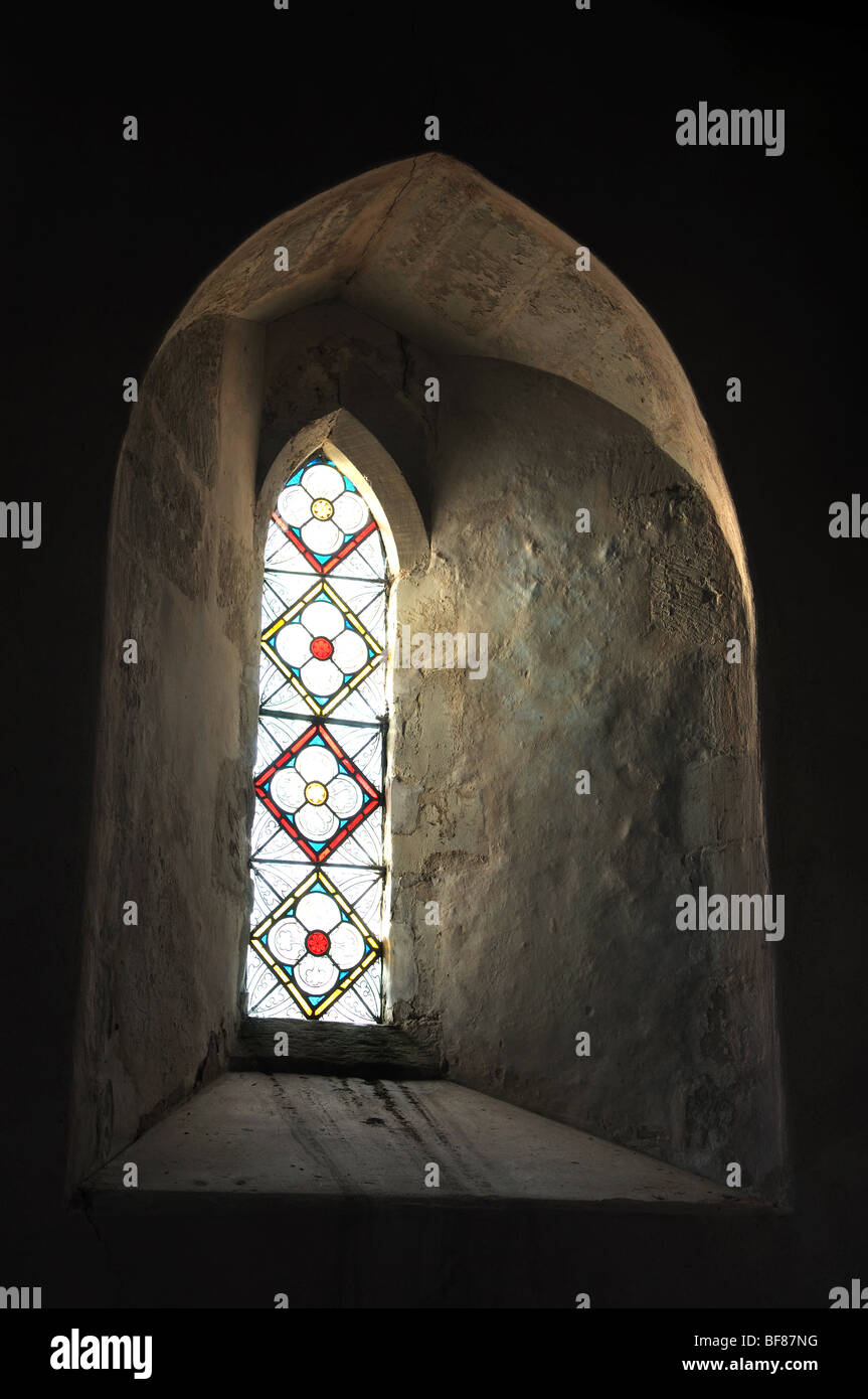 Small window in St. Mary`s Church, Wolverton, Warwickshire, England, UK Stock Photo